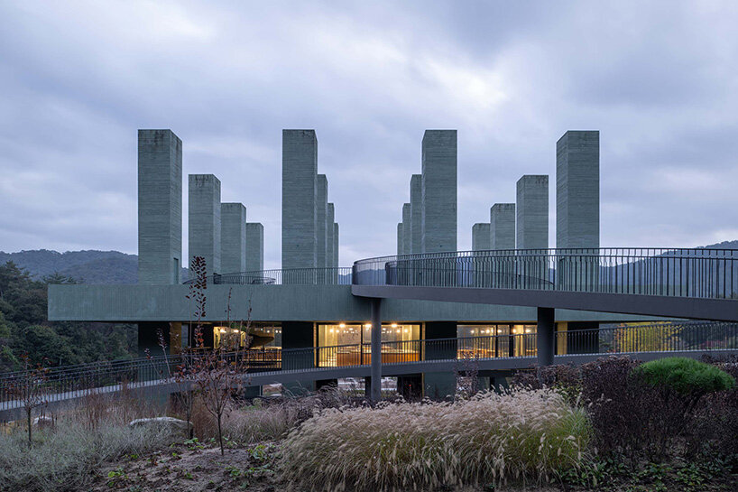 pezo von ellrichshausen raises field of inhabitable columns for restaurant in south korea