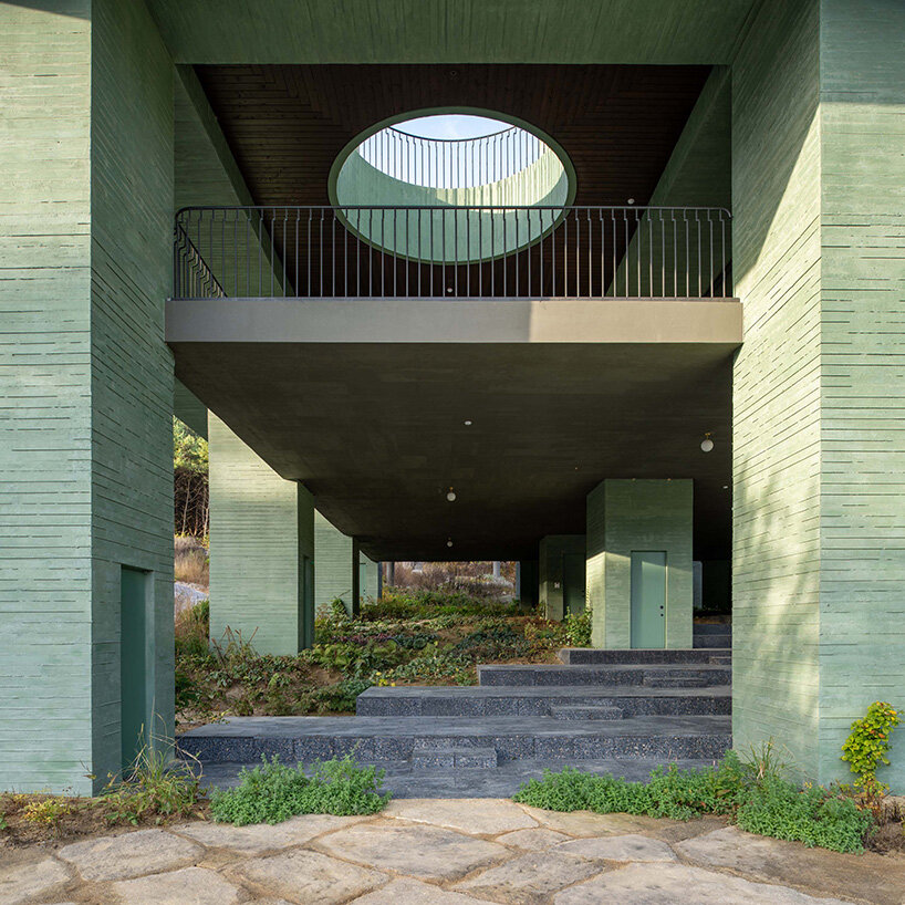 pezo von ellrichshausen raises field of inhabitable columns for restaurant in south korea