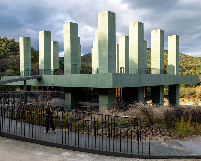 pezo von ellrichshausen raises field of inhabitable columns for restaurant in south korea