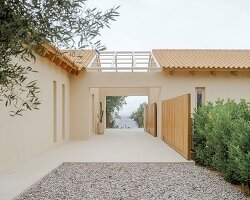 pitched timber roofs unify greek renovation project by local firm oblq