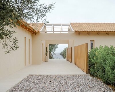 pitched timber roofs unify greek renovation project by local firm oblq