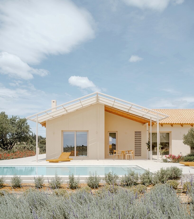 pitched timber roofs unify greek renovation project by local firm oblique