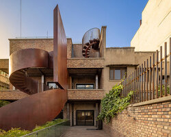 sculptural steel staircase and wall breathes new life into iranian poet’s 1970s home