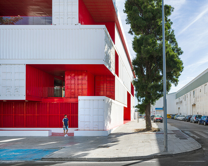 reused shipping containers form high-tech incubator by carquero arquitectura in spain