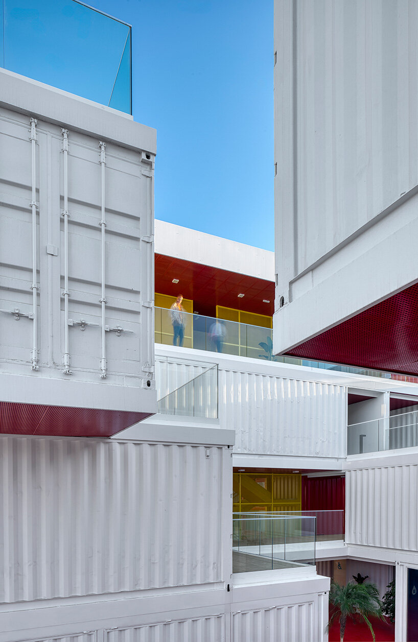 reused shipping containers form high-tech incubator by carquero arquitectura in spain