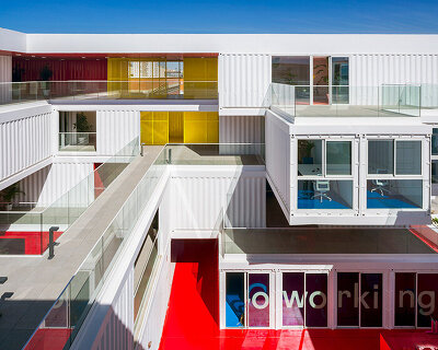 reused shipping containers form high-tech incubator by carquero arquitectura in spain