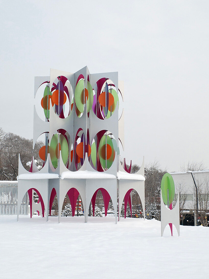 suspended colored discs move through daxing jizi design's faceted installation in beijing