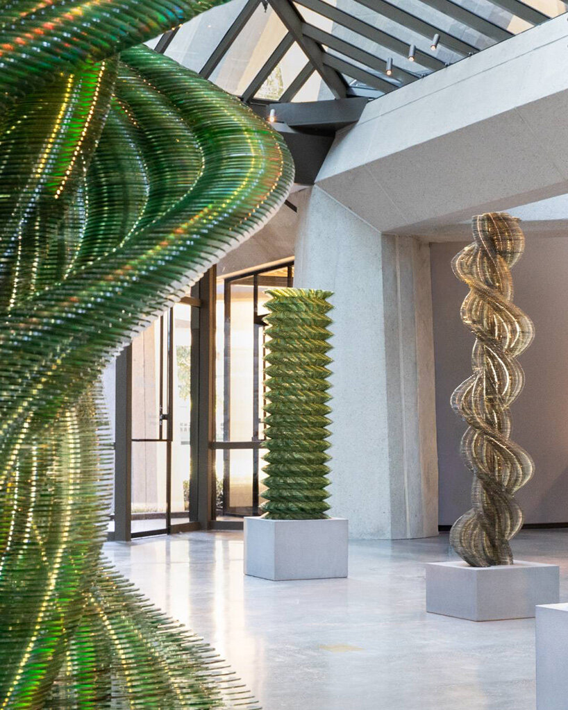thousands of recycled CDs form reflective vertical sculptures in tara donovan's stratagems