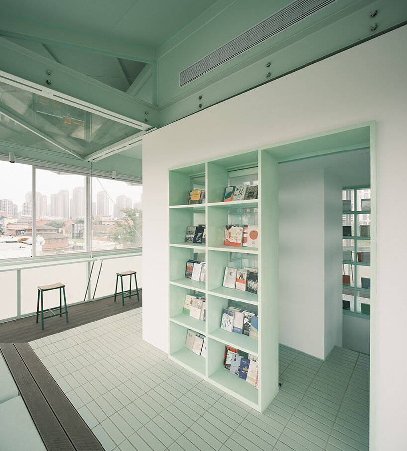tiny 24-hour bookstore by SZ-architects crowns former prison watchtower in china