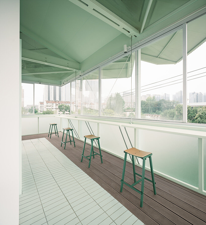 tiny 24-hour bookstore by SZ-architects crowns former prison watchtower in china