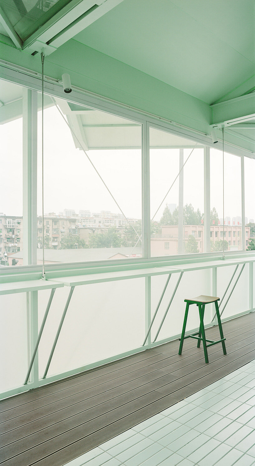tiny 24-hour bookstore by SZ-architects crowns former prison watchtower in china