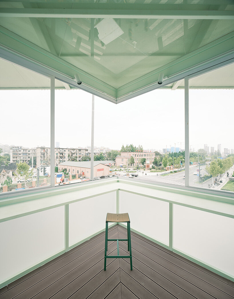 tiny 24-hour bookstore by SZ-architects crowns former prison watchtower in china