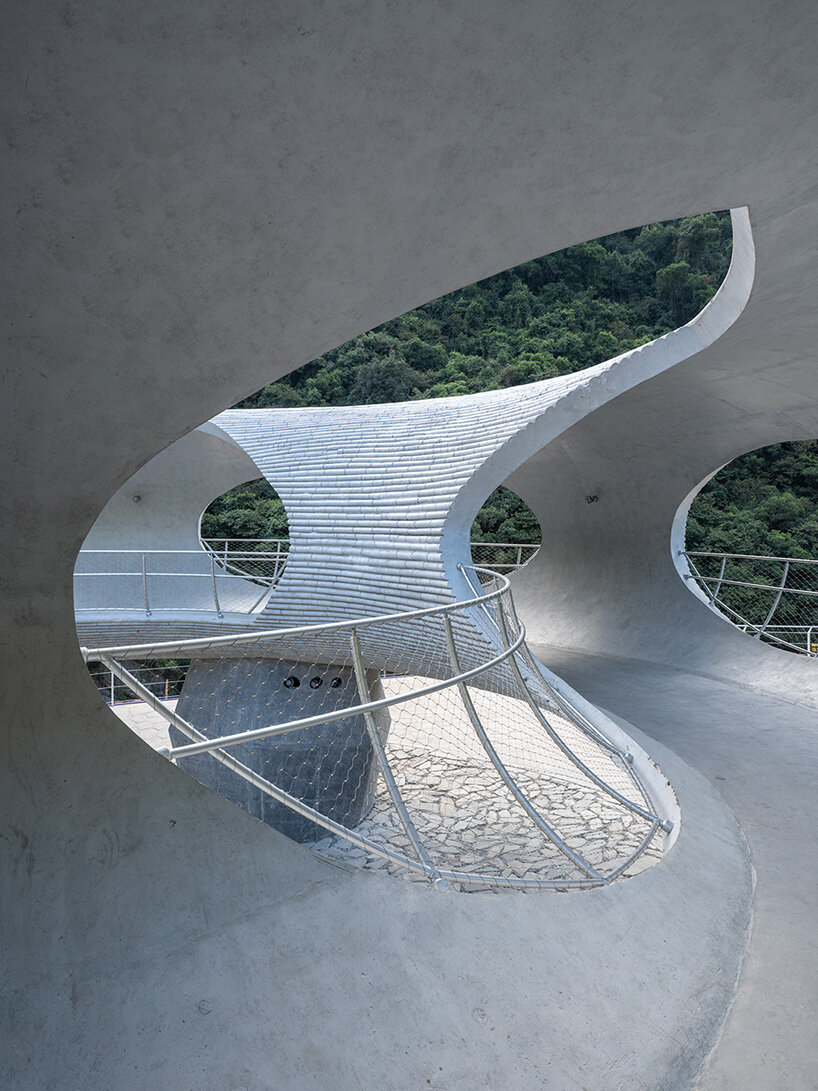 tubular concrete ring by HCCH studio shapes cycling rest pavilion among chinese hills