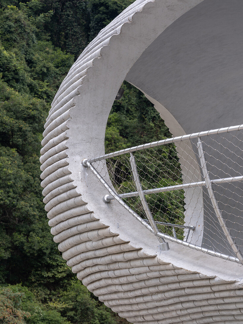 tubular concrete ring by HCCH studio shapes cycling rest pavilion among chinese hills