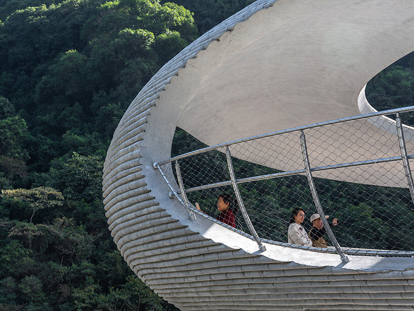 tubular concrete ring by HCCH studio shapes cycling rest pavilion among chinese hills