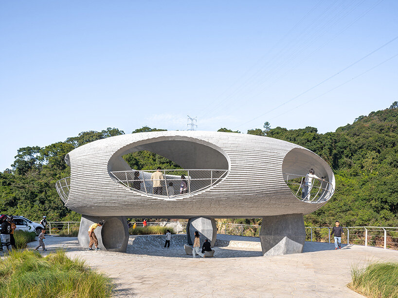 tubular concrete ring by HCCH studio shapes cycling rest pavilion among chinese hills