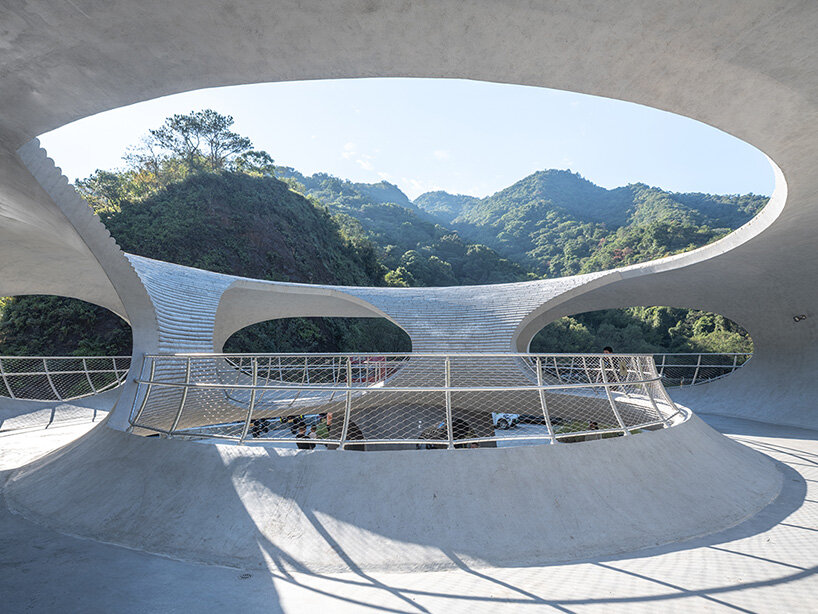 tubular concrete ring by HCCH studio shapes cycling rest pavilion among chinese hills