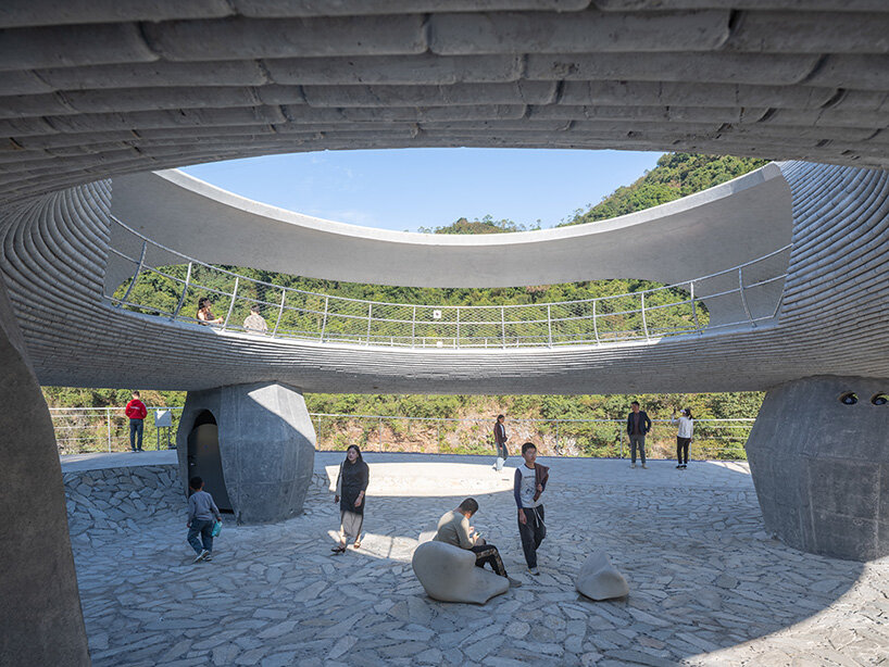 tubular concrete ring by HCCH studio shapes cycling rest pavilion among chinese hills