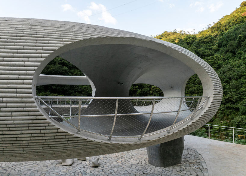tubular concrete ring by HCCH studio shapes cycling rest pavilion among chinese hills