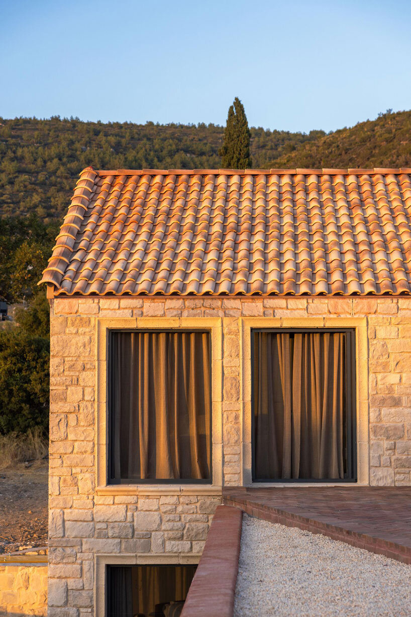 lime-washed facade in terracotta tones enfolds urla family home in turkey