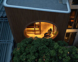 vespa-inspired curved geometry shapes vietnam residence clad in wood