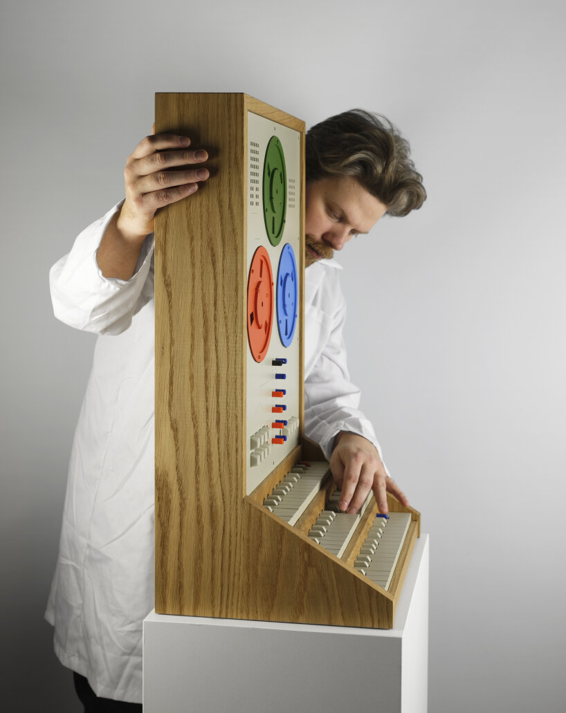 the instrument is housed in a wooden cabinet-like material with visible grain