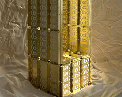 letters printed across brass chair turn mathematical paradox into NYC political commentary