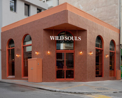 terracotta tiles clad wild souls clean-eating venue’s exterior by studiomateriality in athens