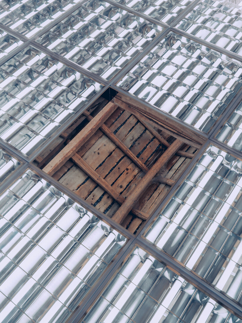alexandre de betak inserts reflective light installation into traditional swiss barn