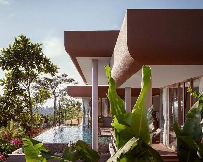 homestay’s raised platforms and elevated pools trace cambodia’s mountainscape