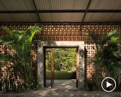 a series of porous brick partitions enclose central garden within costa rica residence