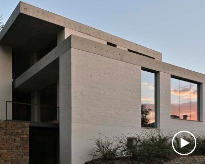 chado’s monolithic white concrete brick office stands near botanical garden in russia