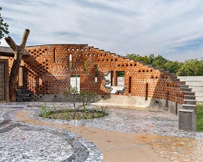 curved brick patterned walls frame farmhouse by manoj patel in india
