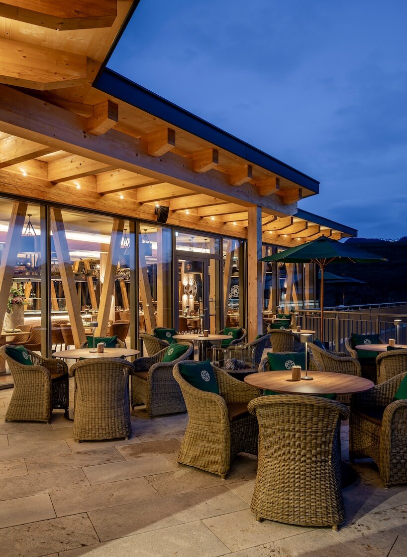 curved cabins show off 180 degree mountain view at sonnenalp resort in southern germany