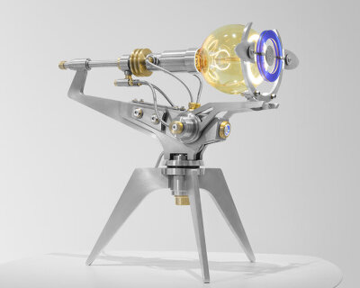 dimmable ‘sun’ surrounds spherical bulb in frank buchwald’s machine light with MB&F