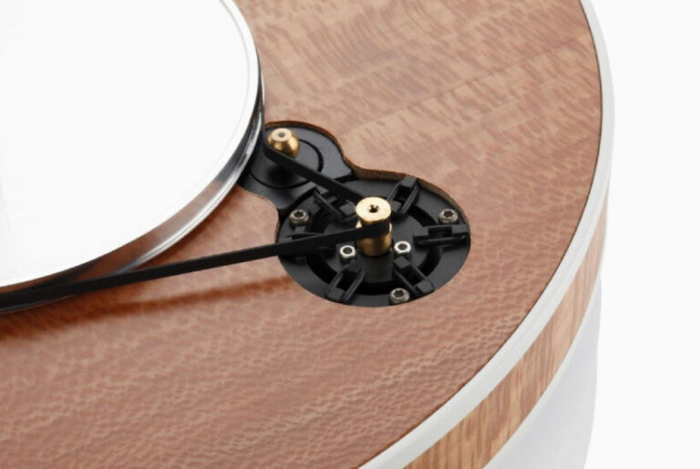 clearaudio's electric guitar-shaped turntable spins records on wood