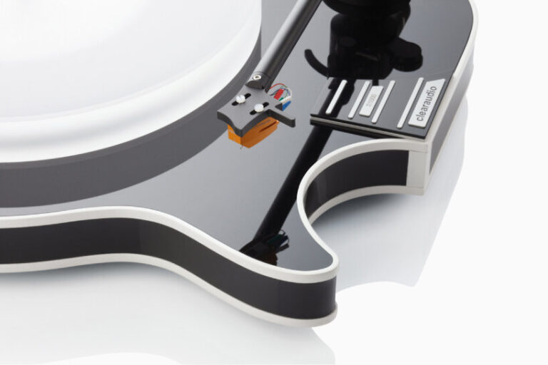 clearaudio's electric guitar-shaped turntable spins records on wood