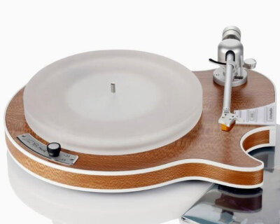 electric guitar-shaped turntable spins vinyl records on frosted platter and wooden base