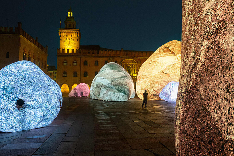 ENESS installs luminous inflatable boulders in bologna's historic piazza maggiore