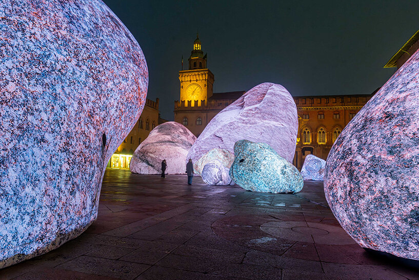 ENESS installs luminous inflatable boulders in bologna's historic piazza maggiore
