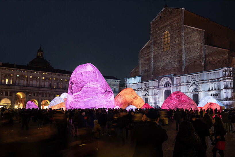 ENESS installs luminous inflatable boulders in bologna's historic piazza maggiore