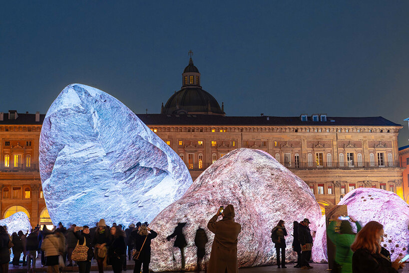 ENESS installs luminous inflatable boulders in bologna's historic piazza maggiore