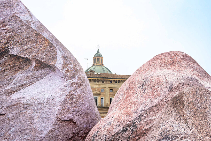 ENESS installs luminous inflatable boulders in bologna's historic piazza maggiore