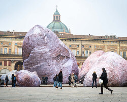 ENESS installs luminous inflatable boulders in bologna's historic piazza maggiore