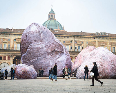 ENESS installs luminous inflatable boulders in bologna's historic piazza maggiore
