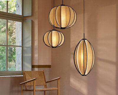 forestier’s solis pendants by jette scheib radiate a soft glow with hand-woven raphia