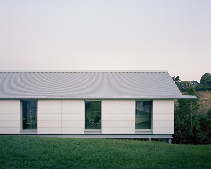 HANGHAR assembles steel-framed prefab residence in 48 hours on sloped spanish plot