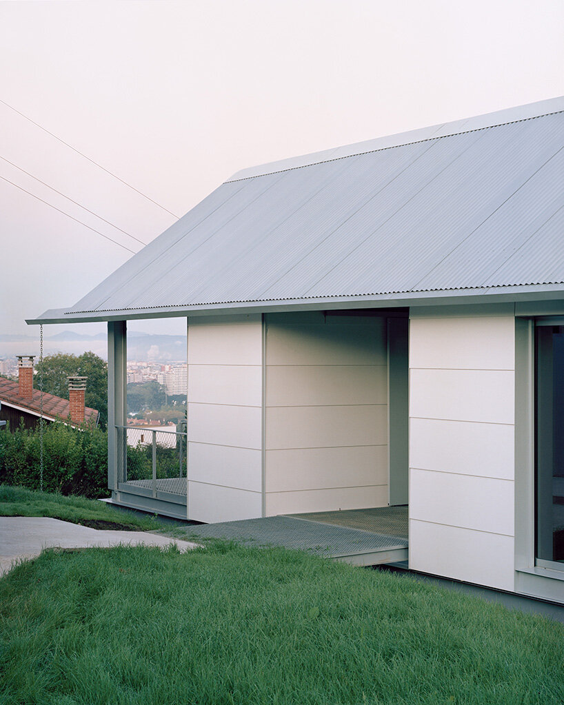 HANGHAR assembles steel-framed prefab residence in 48 hours on sloped spanish plot