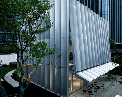 a perforated, fluted facade peels away from TAOA-designed hangzhou empathy museum