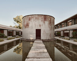 k-studio expands its wine factory-turned-hotel 'dexamenes' along the coast of greece